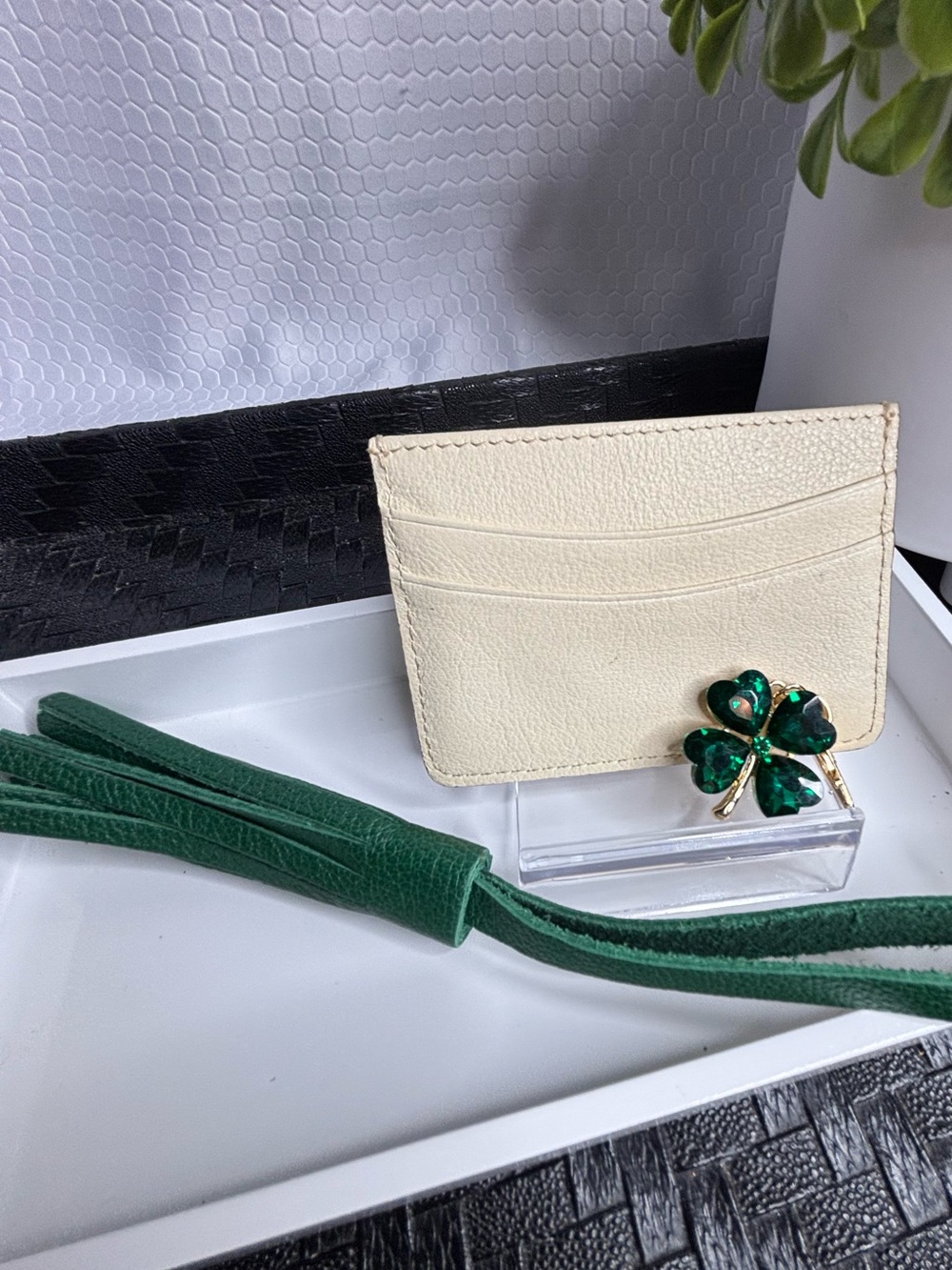 Dooney & Bourke Cream Card Holder with Green Tassel and Clover Pin